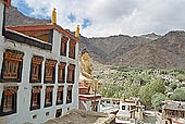 Ladakh - Hemis Gompa, the main monastery halls with the characteristc red painted windows and woden balconies on white washed faades